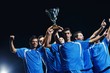 soccer players celebrating victory