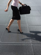 Photo: adult woman trying to balance on high heels shoes adult woman trying to balance on high heels shoes