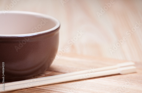 Photo: Bowl with chopsticks. Bowl with chopsticks.