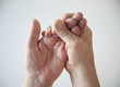 a man tries to restore feeling in his numb hand