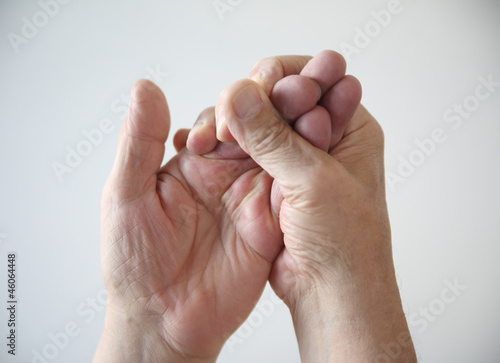Photo: a man tries to restore feeling in his numb hand a man tries to restore feeling in his numb hand