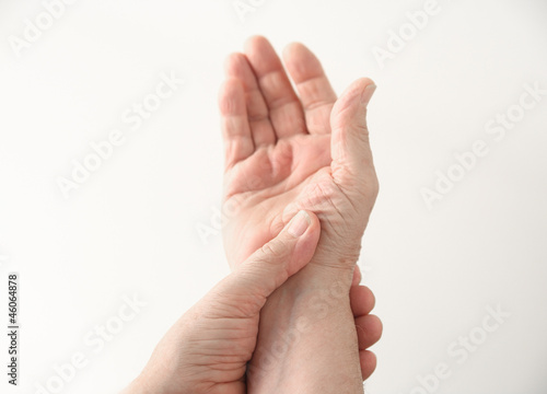 Photo: a man with pain at the base of his thumb a man with pain at the base of his thumb