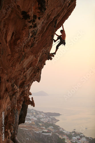 Fototapeta Rock climber at sunset, Kalymnos Island, Greece