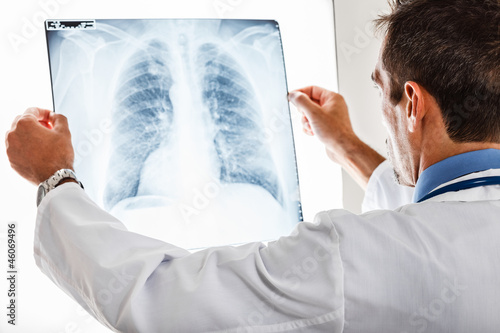 Photo: Doctor examining a radiography Doctor examining a radiography