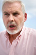 An angry elderly man