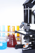 Microscope and other laboratory glassware with reagents