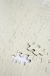 Blank jigsaw puzzle with one piece missing, close up