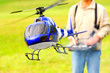 Piloting Radio controlled helicopter with remote control.