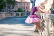 Young beautiful ballerina dancing in Bologna - Pincio, Italy. Ba