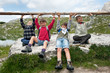 Kids playing in the mountains lifting club. Dolomites, Italy.