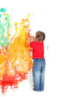 young girl painting over white wall