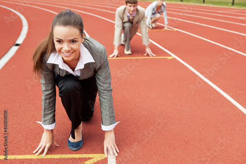 Photo: Business woman at athletic stadium Business woman at athletic stadium
