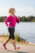 Happy woman jogger training in the park. Healthy lifestyle and p