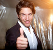 Smiling businessman with Thump up
