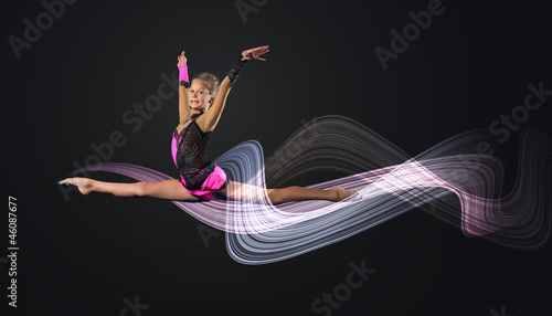 Photo: Young woman in gymnast suit posing Young woman in gymnast suit posing