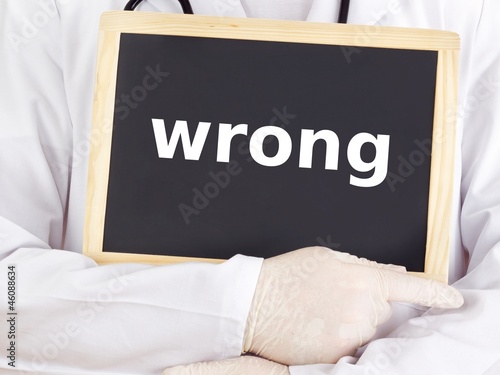 Photo: Doctor shows information on blackboard: wrong Doctor shows information on blackboard: wrong