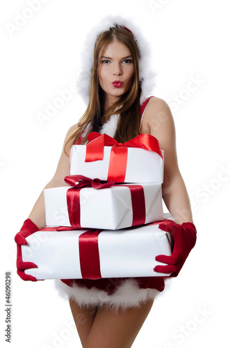 Photo: The Christmas girl with boxes of gifts isolated The Christmas girl with boxes of gifts isolated