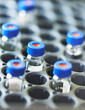 Close-up little labolatory flasks in cartridge