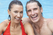Man & Woman Couple Relaxing In Swimming Pool