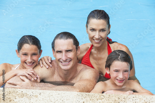 Photo: Happy Family In Swimming Pool Happy Family In Swimming Pool