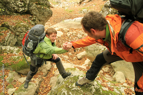 Photo: A friend lends a helping hand. A friend lends a helping hand.