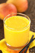 Fresh homemade mango juice in glass with straws