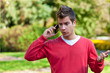 Young man communicating on smartphone
