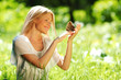 Woman playing with a butterfly
