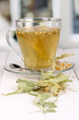Glass cup of tea with linden