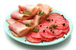 tasty bacon and sausage with spices on plate, isolated on white