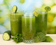 Three kinds of green juice on bright background