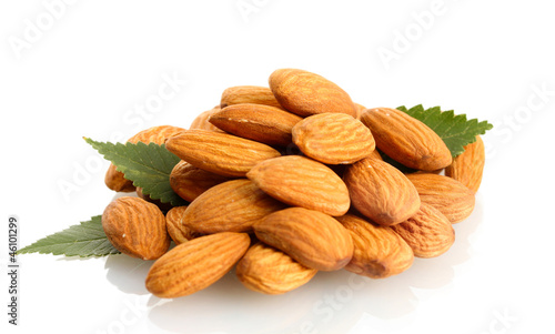 Photo: tasty almonds nuts with leaves, isolated on white tasty almonds nuts with leaves, isolated on white