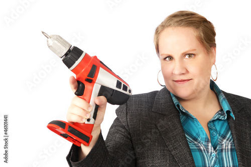 Photo: Handy housewife with electric drill Handy housewife with electric drill