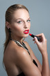 Young woman model with glamour red lips,bright makeup, eye arrow