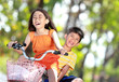Photo: kids riding bike together kids riding bike together