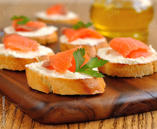 Photo: Sandwiches with a salmon on a brown table Sandwiches with a salmon on a brown table