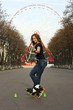Photo: Attractive student rollerblading in summer Attractive student rollerblading in summer