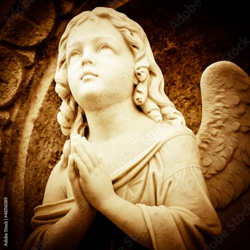 Photo: Praying angel in sepia shades Praying angel in sepia shades