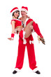 Happy young couple wearing santa claus clothes