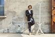 the courtyard of old factory building, portrait of a young man