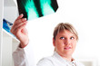 Photo: Female medic looking at x-rays Female medic looking at x-rays