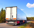 Trailer on the finland road in sunny day