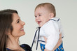 mother having fun with little baby daughter