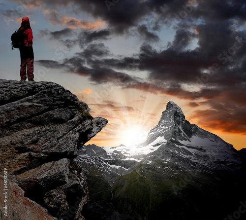 Photo: girl looking at the beautiful Mount Matterhorn in the Swiss Alps girl looking at the beautiful Mount Matterhorn in the Swiss Alps