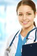 A portrait of a female doctor with a folder in uniform indoors