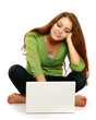A smiling woman is working with a laptop on white background