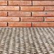Closeup of the red brick wall texture background and rope carpet
