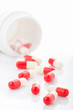 Pills spilling out from prescription bottle