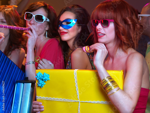 Photo: having fun with party horns and presents having fun with party horns and presents