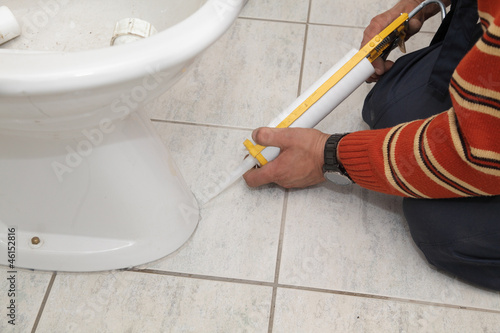 Photo: Plumber fixing bidet with silicone cartridge, washroom Plumber fixing bidet with silicone cartridge, washroom